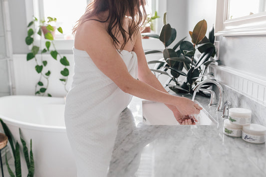Woman washing her hands at the sink