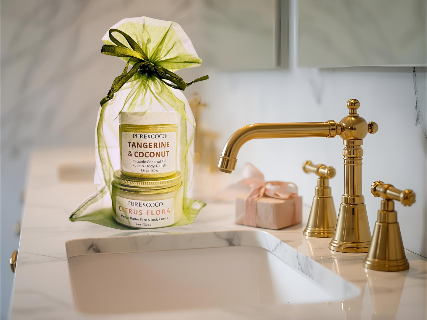 Pure & Coco Tangerine & Coconut Polish and Citrus Flora Crème displayed on marble counter with gold faucet — luxury 2-step skincare ritual for dry, sensitive skin.
