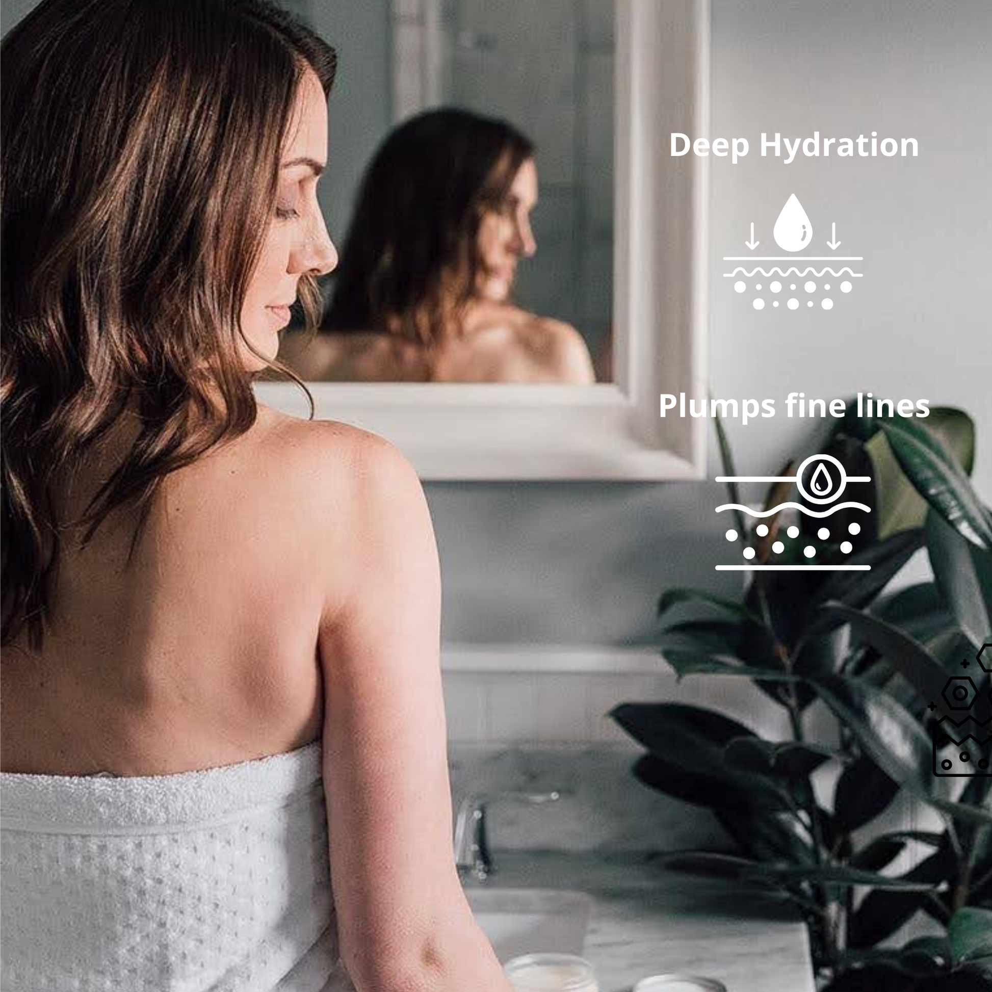 Woman standing in front of a mirror wrapped in a white towel overlooking her shoulder down at the benefits of the Citrus Flora Mango Butter Face & Body Creme_4 oz_Pure and Coco