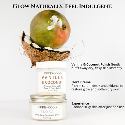 Vanilla and coconut organic coconut oil face and body polish sitting on top of a jar of the Flora mango butter face and body creme by pure and coco with half a coconut and a mango sitting proped ontop creating a tower